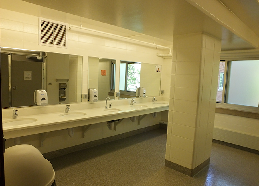 Community bathroom view of sinks