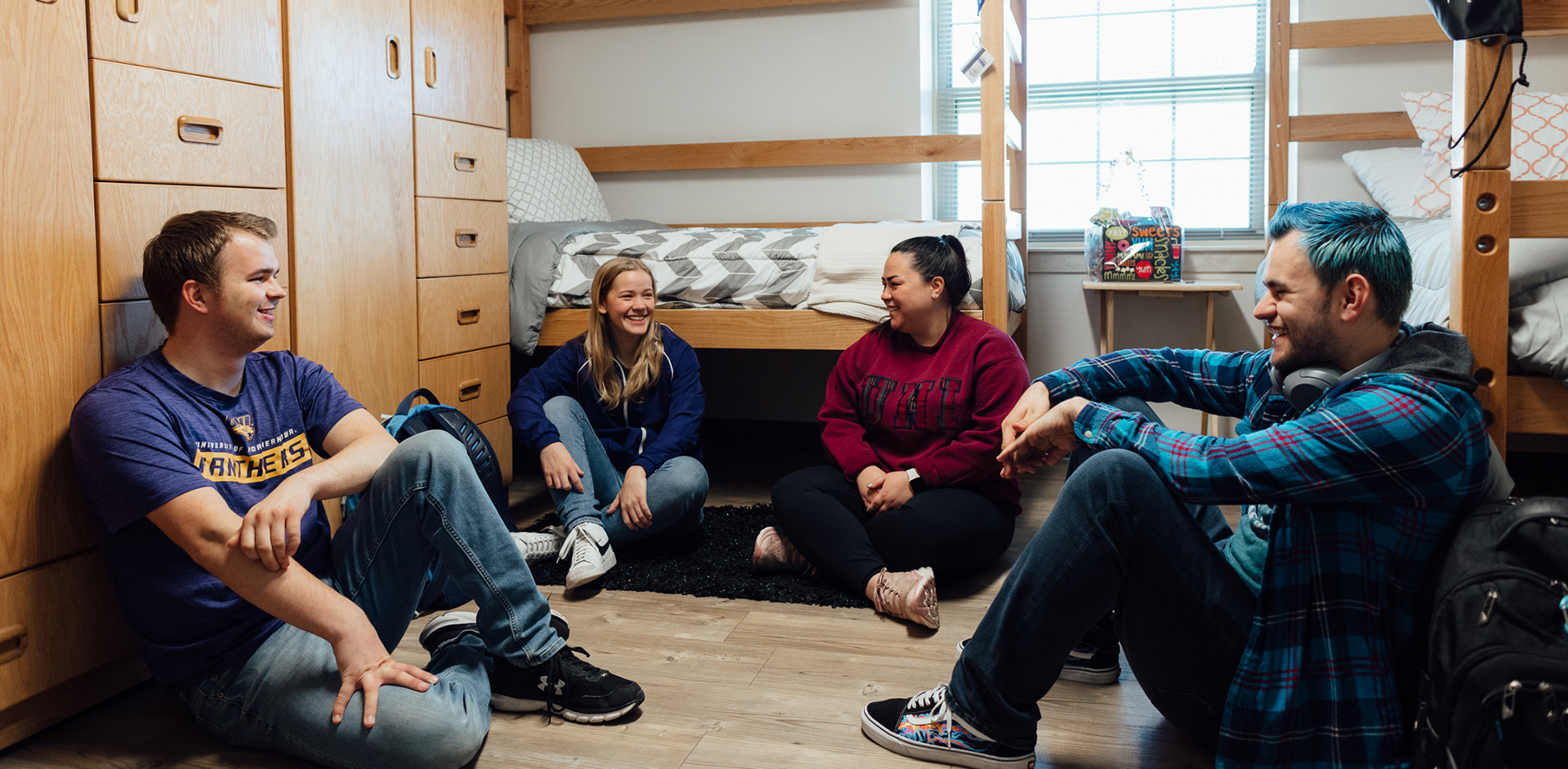 Students gathered in a dorm room