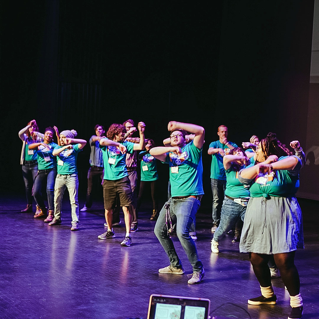 Students dancing on stage.